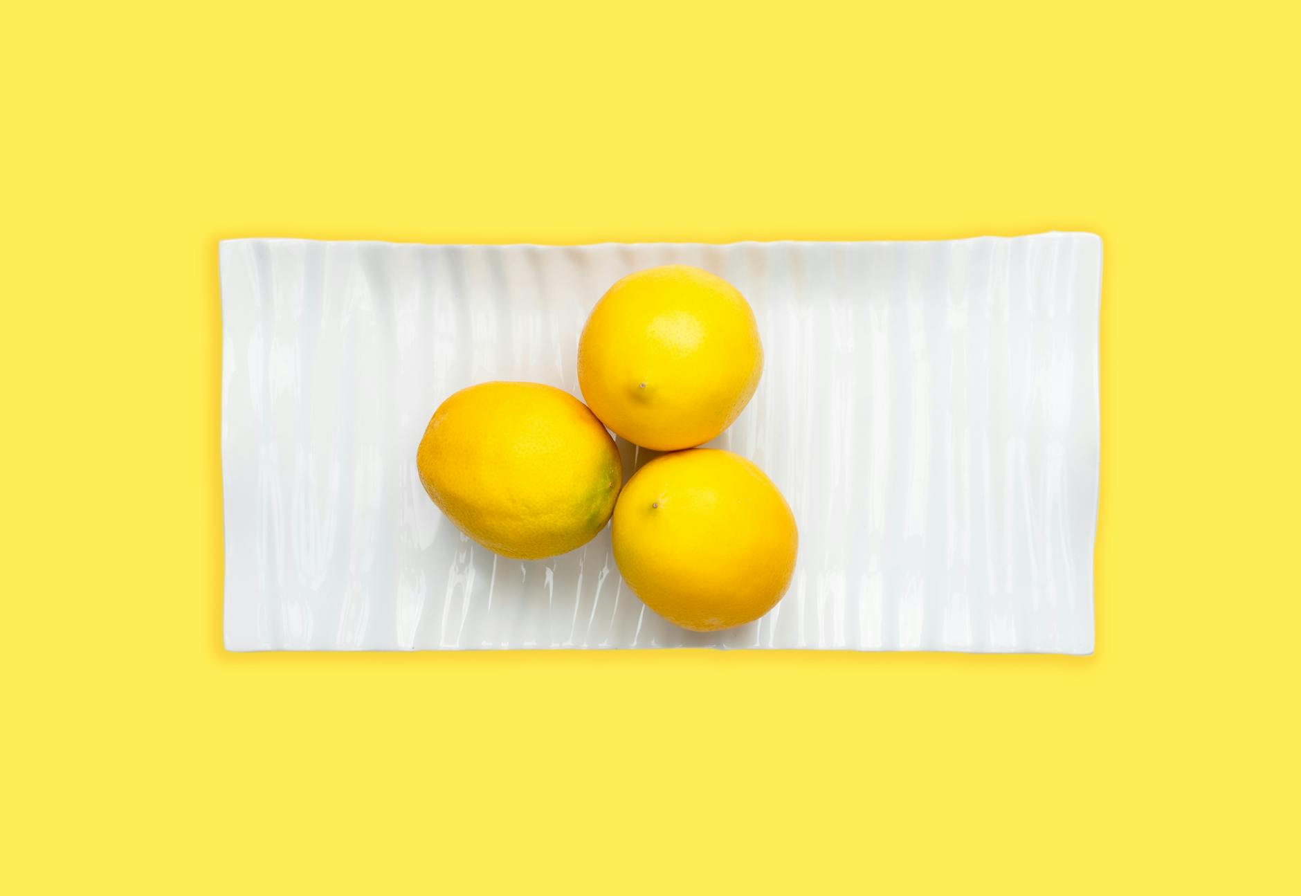 Colorful adult toys and vibrators on a bright yellow background, representing pleasure recovery and sensation