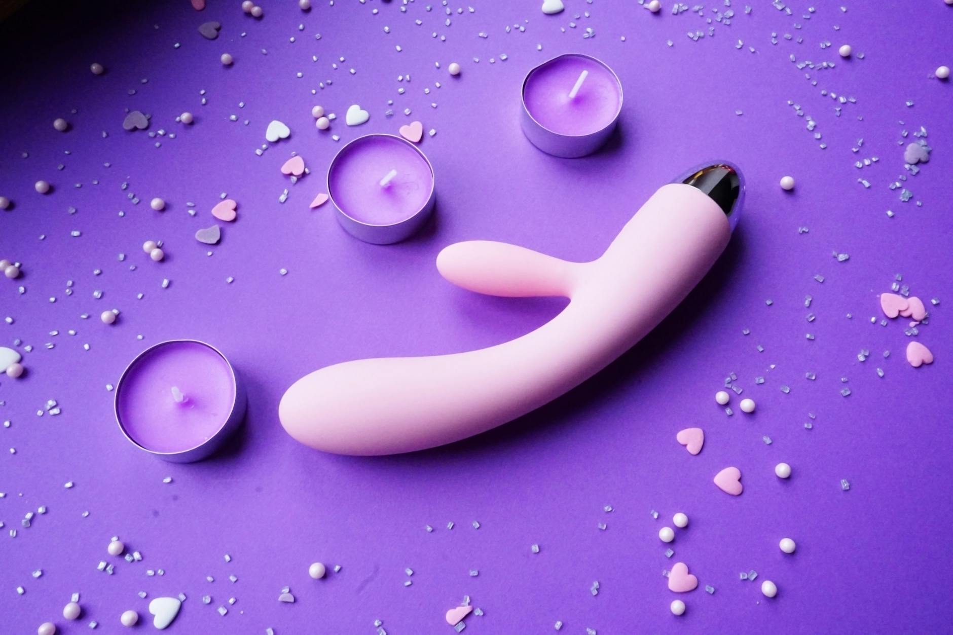A stylish teal vibrator on smooth white silk fabric, perfect for restoring pleasure and sensation